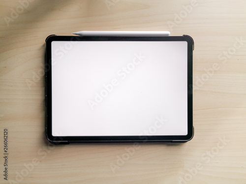 11 inches new pro tablet empty screen with pen and male hands holding it