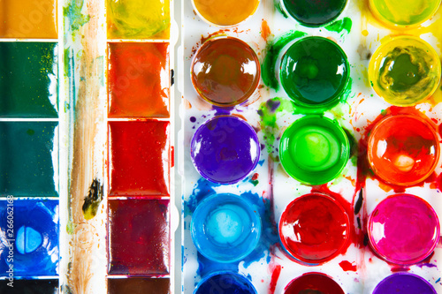 Obraz na płótnie A set of children's paints in round, rectangular forms close-up. Original creative background w salonie