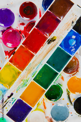 Obraz na płótnie A set of children's paints in round, rectangular forms close-up. Original creative background w salonie