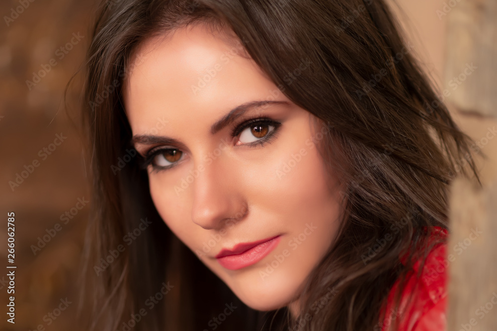 Fashion portrait of a gorgeous young woman in red leather jacket, sitting in a door of an old abandoned building, looking at the camera. Head shot, retouched for perfect skin, vibrant colors Fashion portrait of a gorgeous young woman in red leather jacket, sitting in a door of an old abandoned building, looking at the camera. Head shot, retouched for perfect skin, vibrant colors