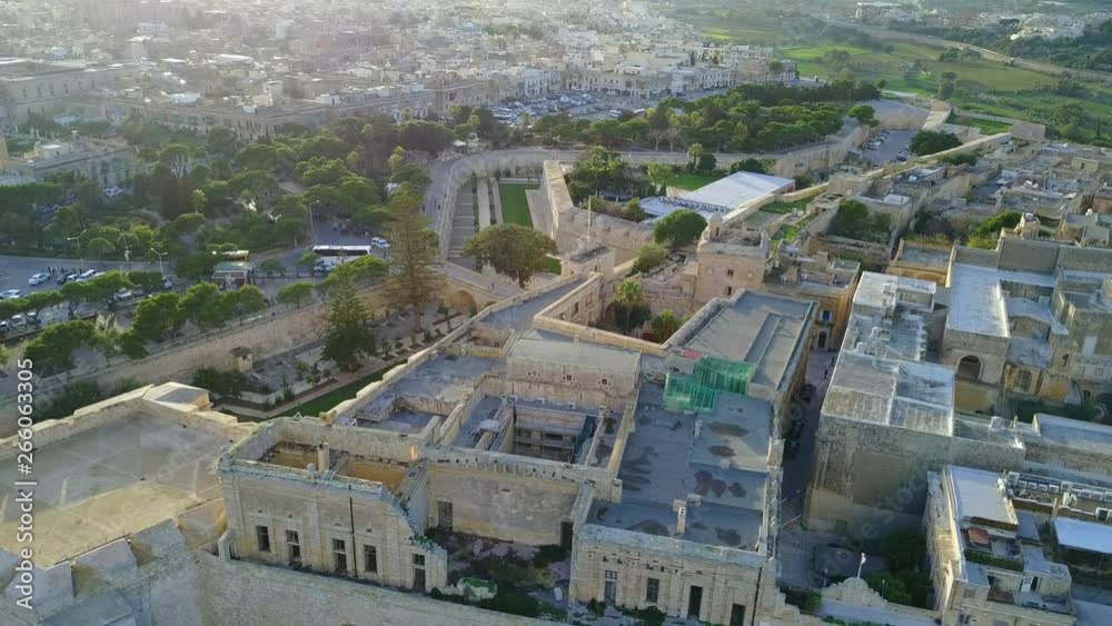 Mdina fortified town in Malta surrounded by ramparts walls bastions aerial view on a winter evening before sunset 