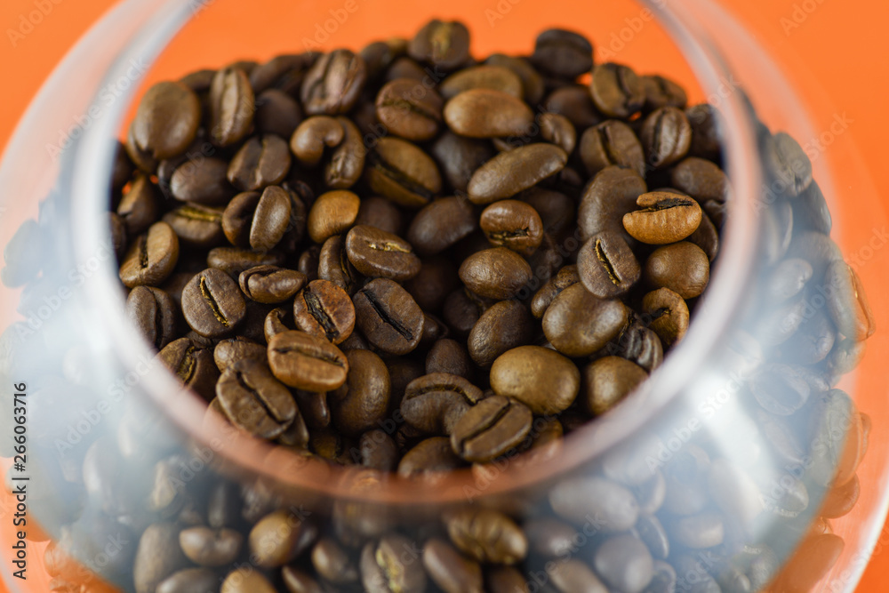 Fototapeta premium Close-up view of coffee beans in a glass . Horizontal photography