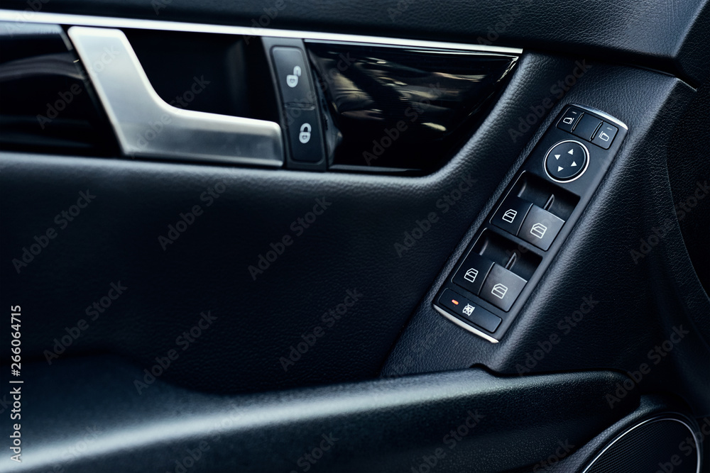 Automatic control panel of car windows close up