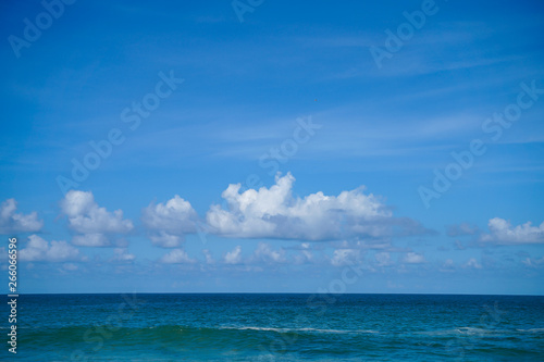 Clouds blue sky and calm sea background landscape