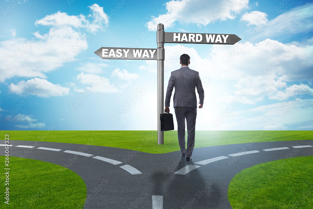 Businessman choosing between hard and easy way Businessman choosing between hard and easy way