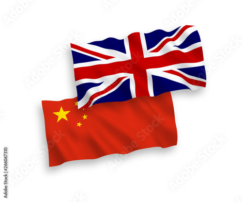 National vector fabric wave flags of China and Great Britain isolated on white background. 1 to 2 proportion.