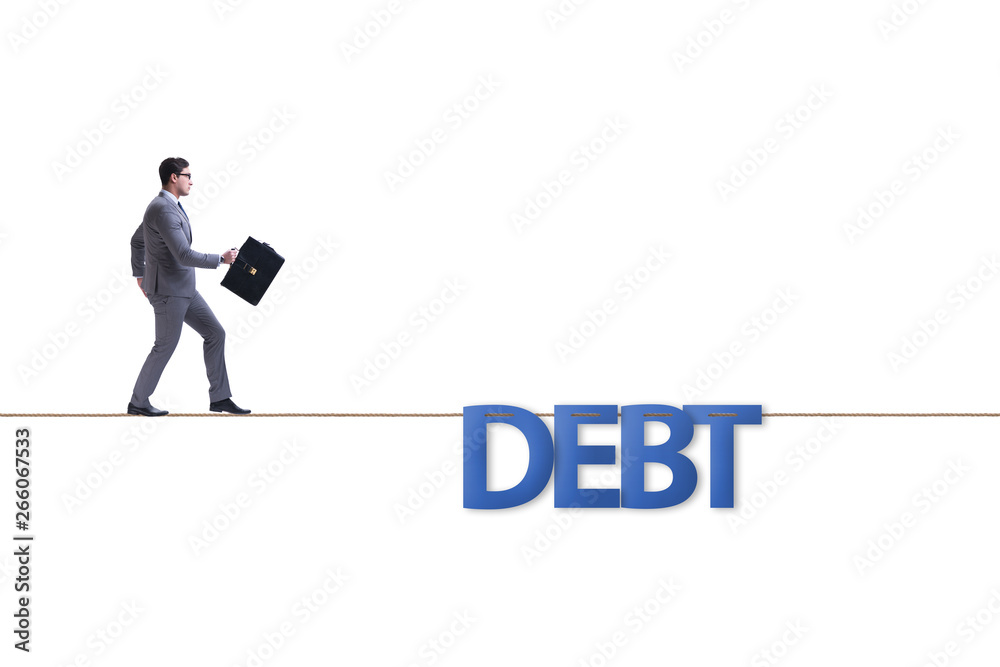Fototapeta premium Debt and loan concept with businessman walking on tight rope