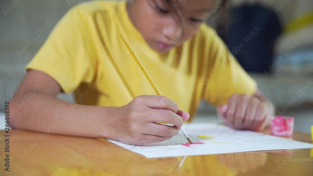 Little student girl study painting and drawing picture, Handheld panning slow motion Little student girl study painting and drawing picture, Handheld panning slow motion