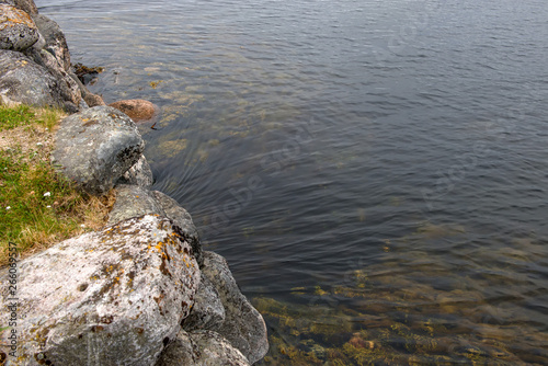 The flow of water. Sea water flows under the stone bridge