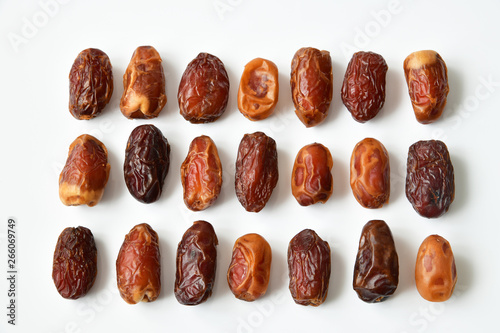 Obraz na plátně Different varieties of dried dates isolated on white background