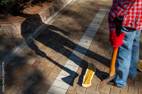 Man with ax gives ominous shadow