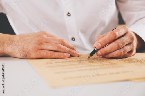 Male lawyer working with contract papers