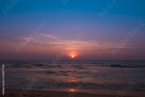 beautiful moody sunset with sea in the foreground © Sunil Aralikatti