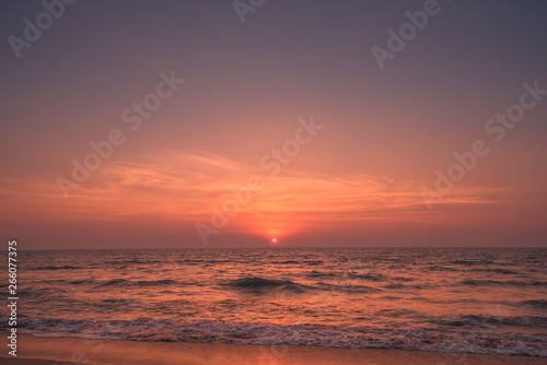 beautiful moody sunset with sea in the foreground © Sunil Aralikatti