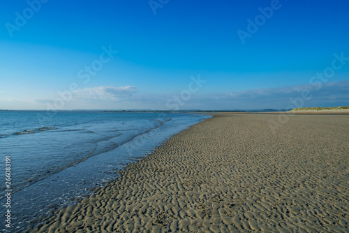 The Calm Sea Meets the Rippled Sand  West Wittering  UK