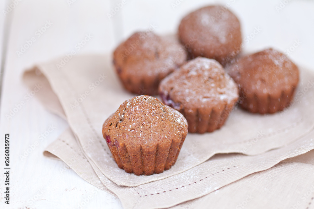 Chocolate muffin on white plate Chocolate muffin on white plate