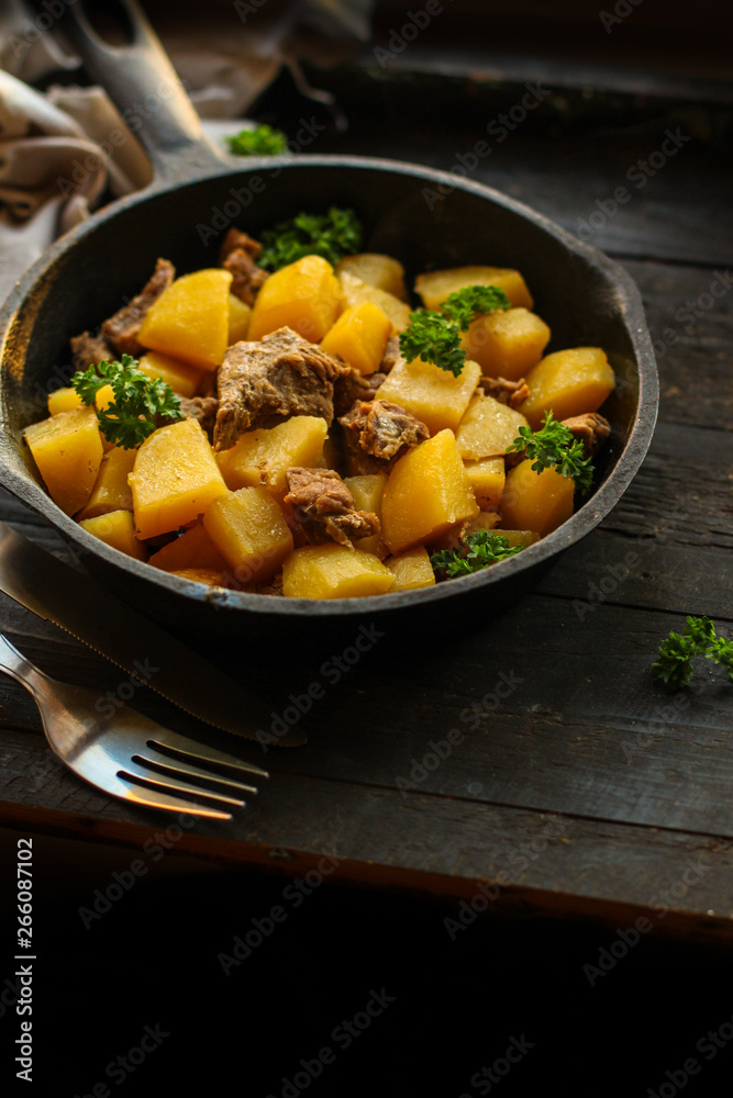 goulash, stewed potatoes with meat. stewed main course. food background. top goulash, stewed potatoes with meat. stewed main course. food background. top