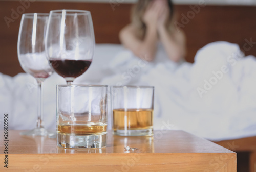 Cheating wife. Unfaithful woman in lover's bed in the morning regretting about last night