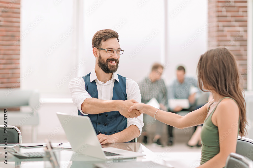 handshake of a Manager and a customer at the Desk