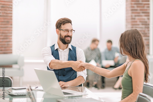 handshake of a Manager and a customer at the Desk