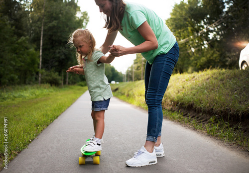 family mother and daughter skateboard sport