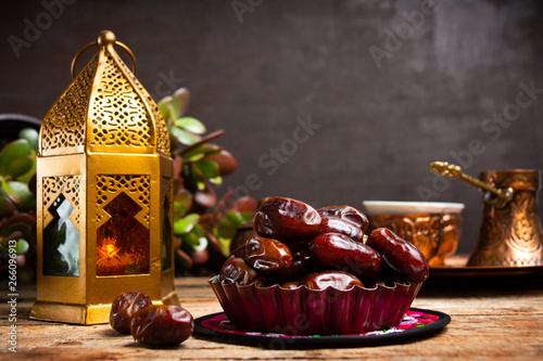 Dates and Arabic style lamp with copy space photo