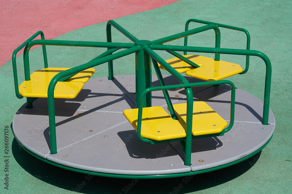Manually powered carousel on a playground. Manually powered carousel on a playground.