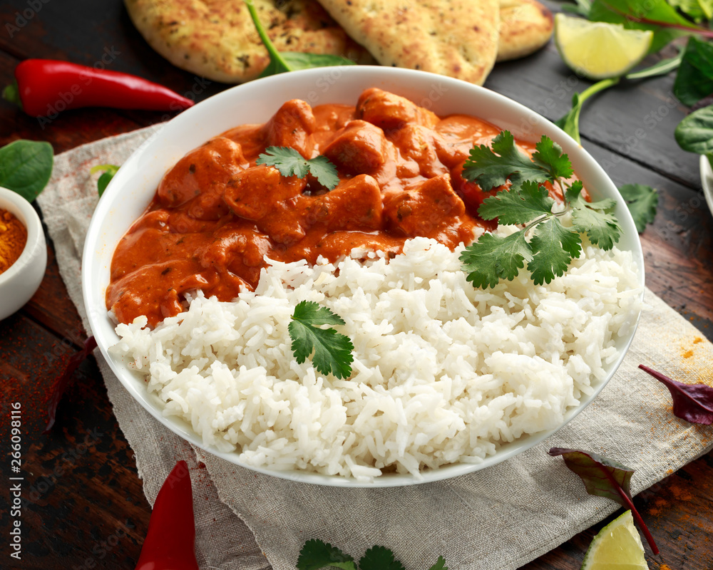 Chicken tikka masala curry with rice and naan bread Chicken tikka masala curry with rice and naan bread