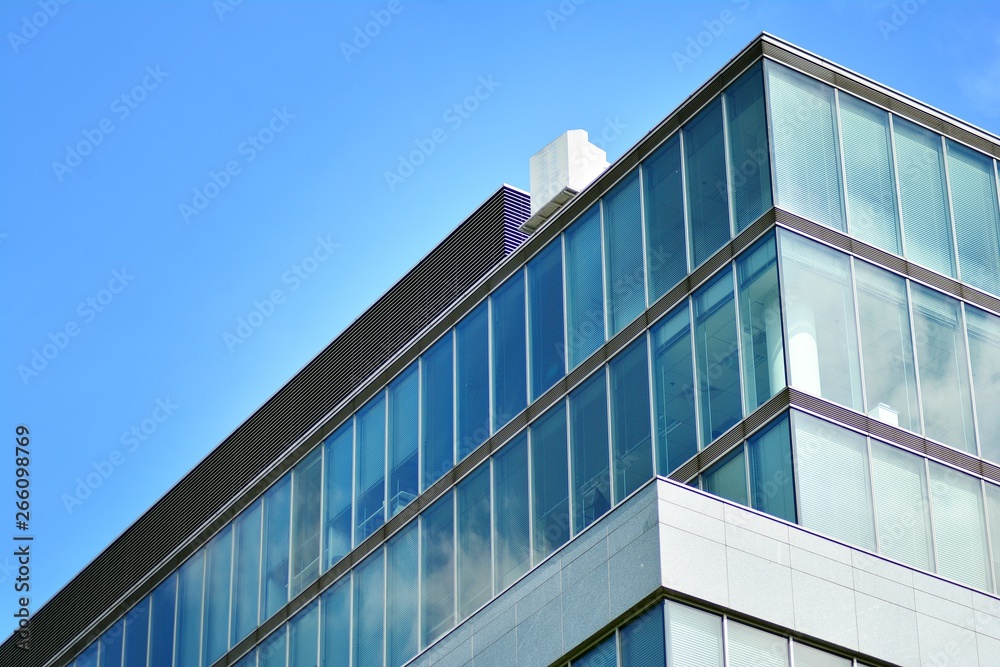 Modern office building with blue sky and clouds Modern office building with blue sky and clouds