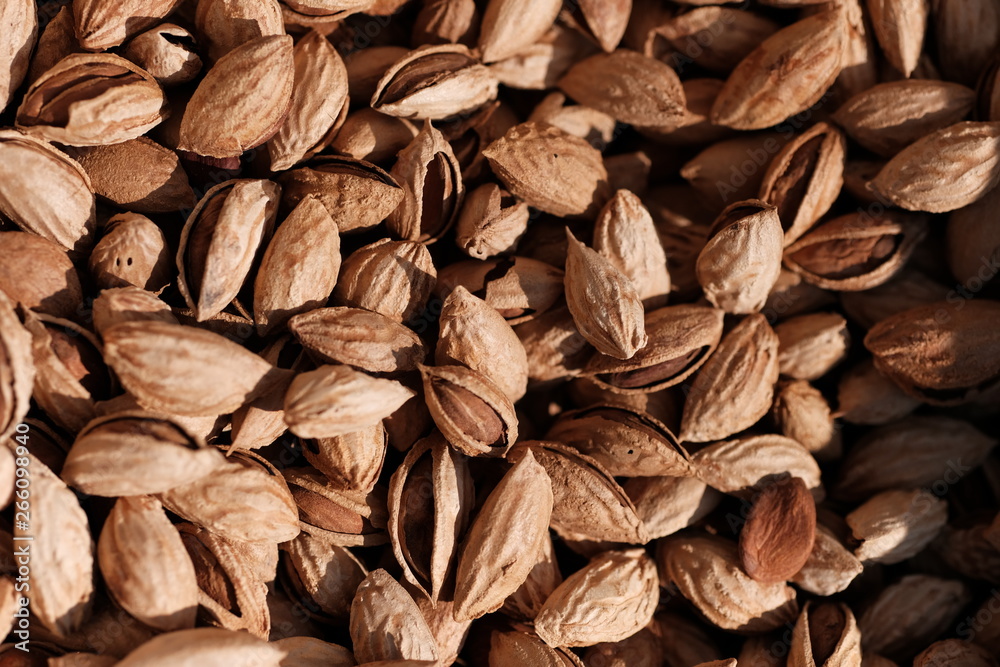 Many almond nuts as natural background 