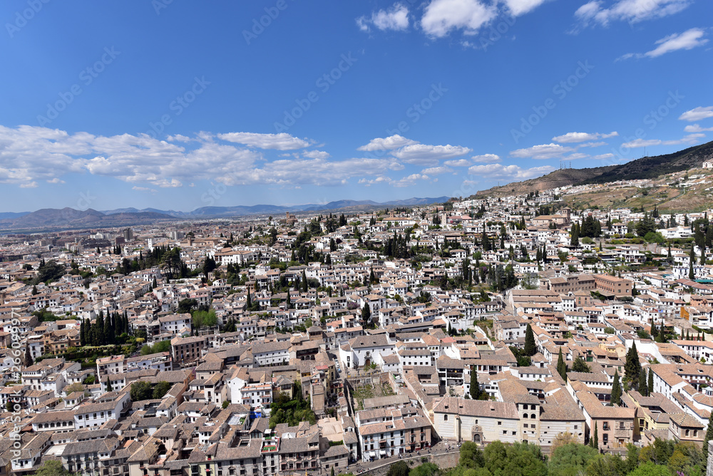 Aerial view of the sprawling city of Granada, Spain with its tile roofs