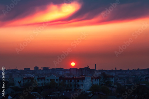 Crimson sunset over dark city © dmf87
