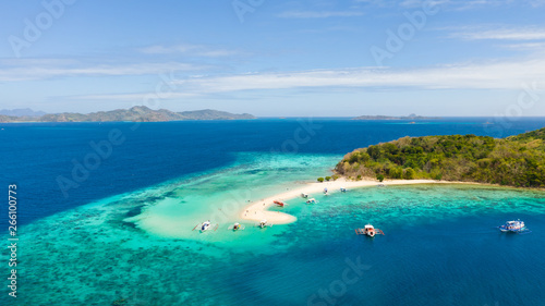 Tropical island with white beach, aerial view.