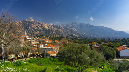 Latmos (Besparmak) Mountain and the village of Kapikiri among the ruins of Heracleia. Milas, Aydin, Turkey. photo
