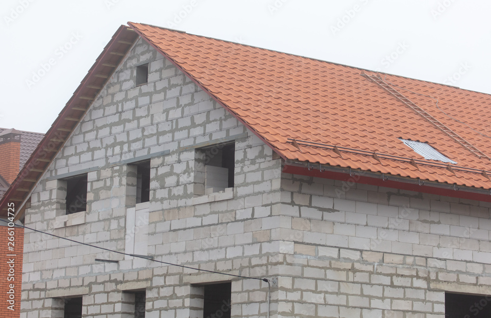 Roof in a brick house under construction