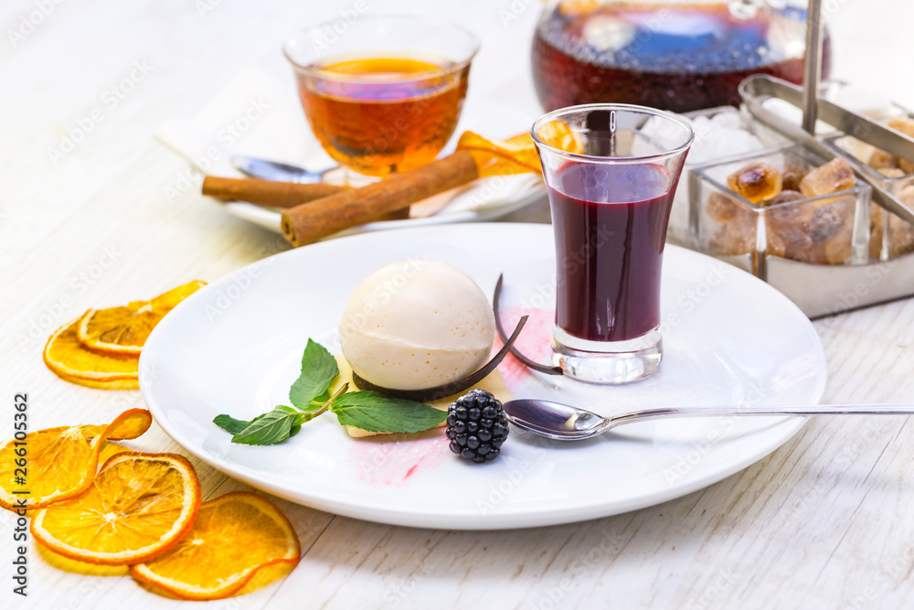 A piece of cake on a served table with tea A piece of cake on a served table with tea