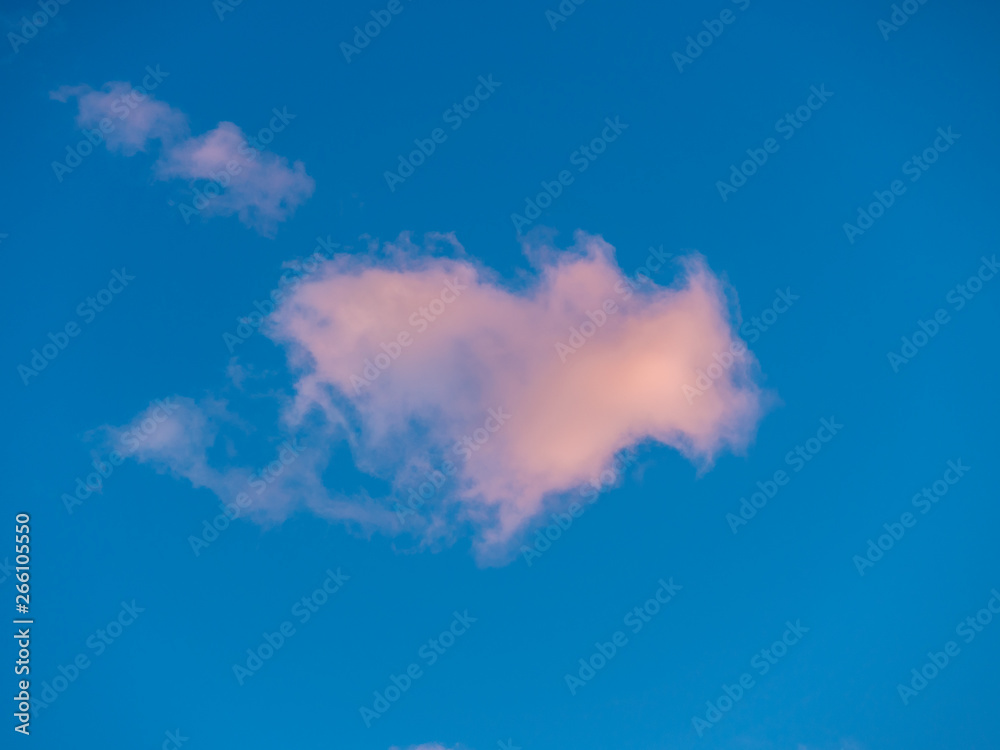 Image of colorful fluffy clouds during sun set and blue sky for backdrop background