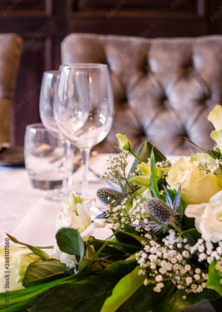 Flowers and Wine Glasses on a Table Set-up Flowers and Wine Glasses on a Table Set-up