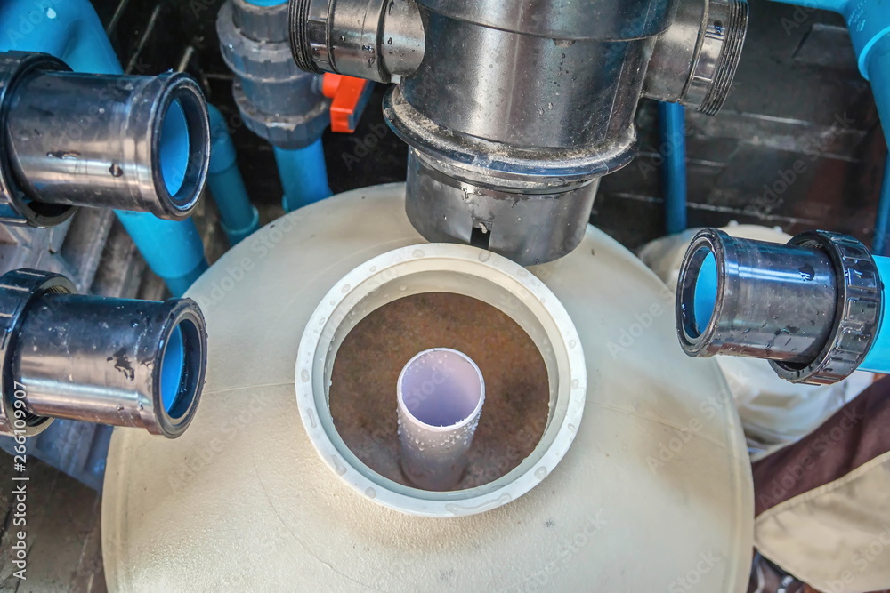 Filling sand into sand filter.Service and maintenance of the pool.Black