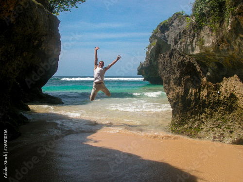 Jump up on an exotic beach between the cliffs overlooking the sea.