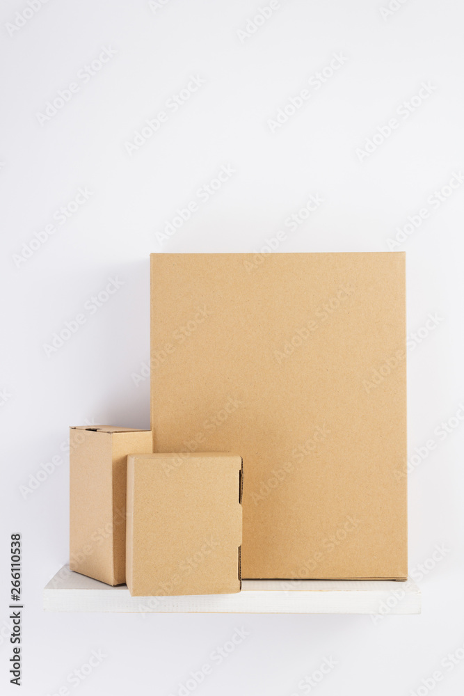 cardboard box on wooden shelf cardboard box on wooden shelf