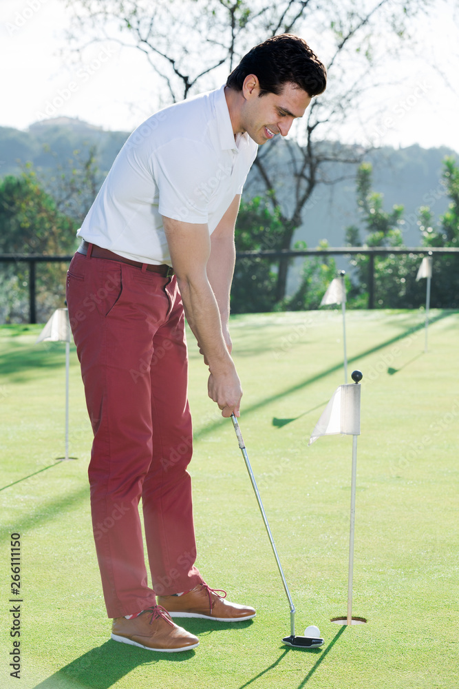 Fototapeta premium Male golfer at golf course