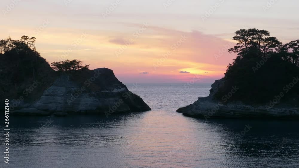 Dramatic Sky at Sunset over the Scenic Coast (left to right panning): Dogashima in Izu Peninsula, Japan Dramatic Sky at Sunset over the Scenic Coast (left to right panning): Dogashima in Izu Peninsula, Japan