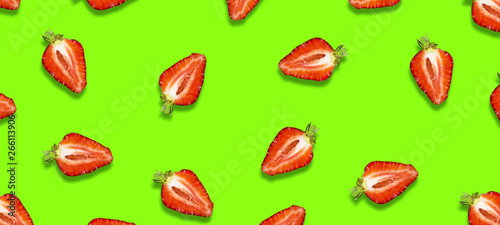 Ripe strawberries on a bright green background. Fresh fruits. Fruit background. Summer party. Birthday.