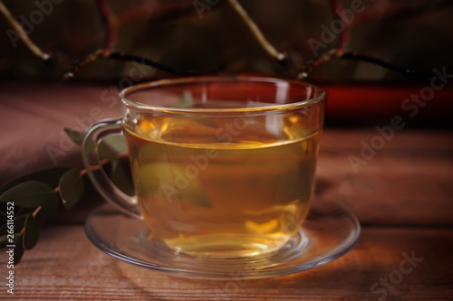 Cup of tea on dark background on the wooden background