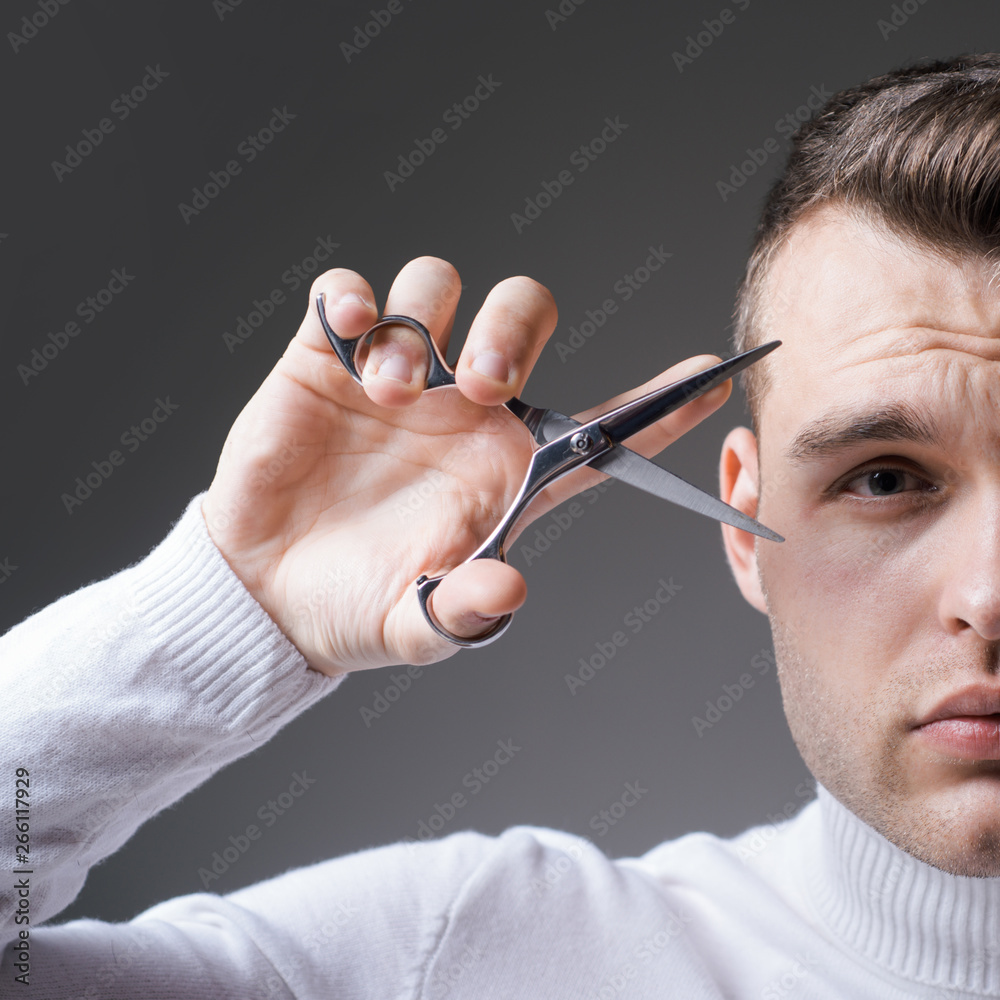 Cut hair. Man strict face hold scissors. Barber glossy hairstyle hold steel  scissors. Create your style. Macho confident barber cut hair. Barbershop  service concept. Professional barber equipment Stock Photo | Adobe Stock