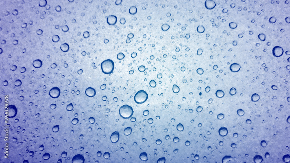 Water droplets texture on blue background