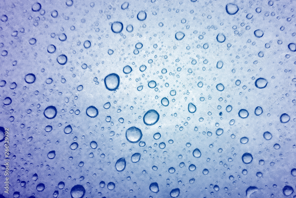 Water droplets texture on blue background