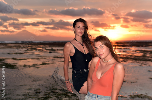 Tourist girls from Europe enjoying the sunset and landscape in Gili Trawangan Islandi Lombok, Indonesia