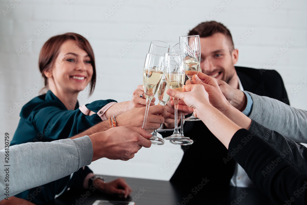 Well done work success young business people toasting each other and smiling while standing in the board room coworking, drink champagne celebrate christmas birthday new year contract Well done work success young business people toasting each other and smiling while standing in the board room coworking, drink champagne celebrate christmas birthday new year contract